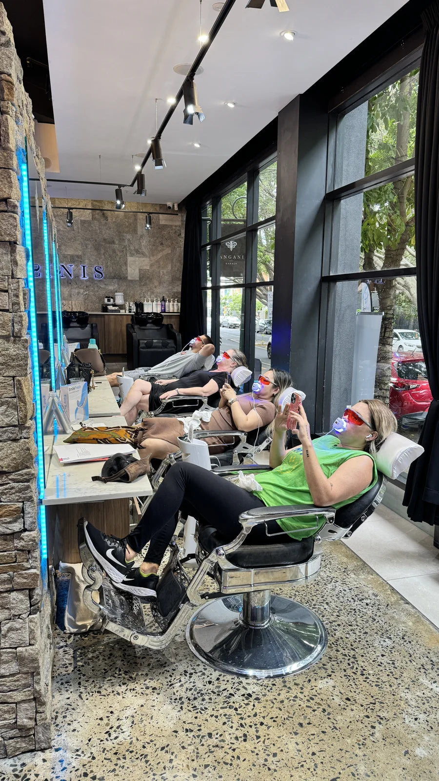 Clients enjoying their SmileFresh whitening appointments in the salon